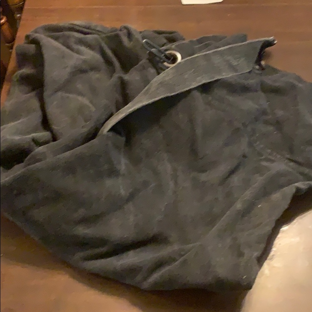 Giant, black duffel bag.